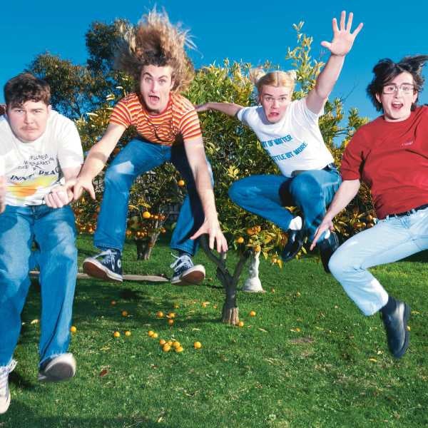Photo of 4-piece Teenage Dads up into the air. All four men wear tshirts and jeans
